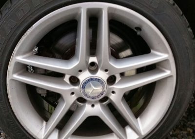 Image of an alloy wheel with scrapes