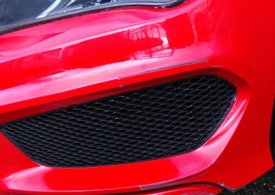 Image of a Mercedes with a bumper scuff