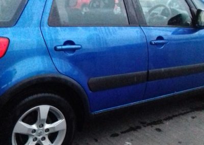 Image of a completed car door requiring repair
